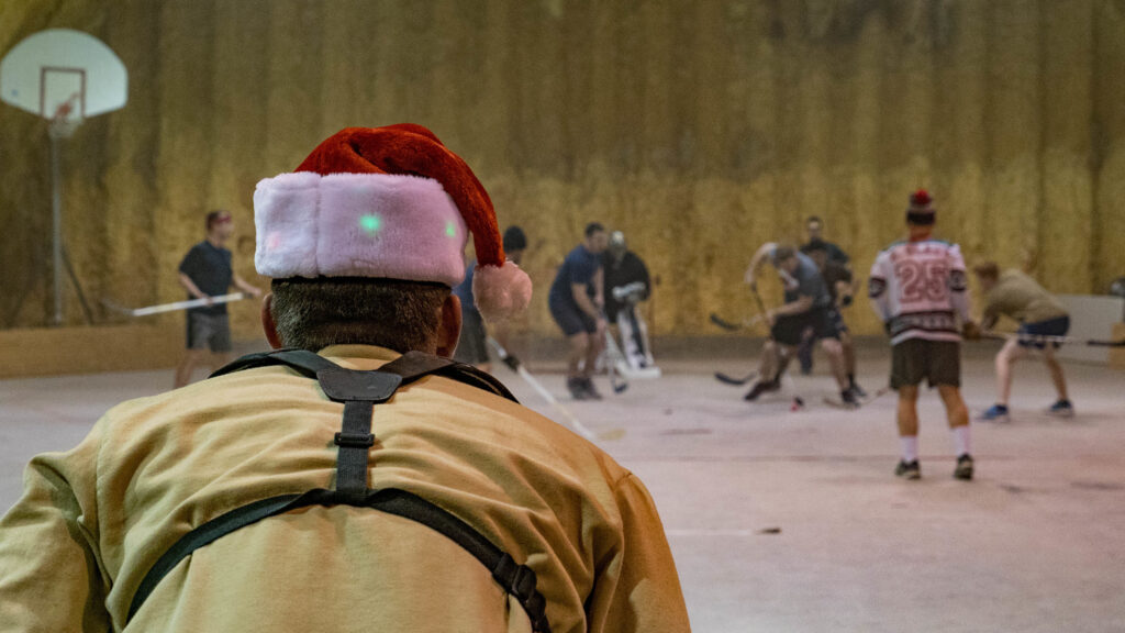 Deployed members play hockey in an empty hanger at Kandahar Air Field, Afghanistan. 