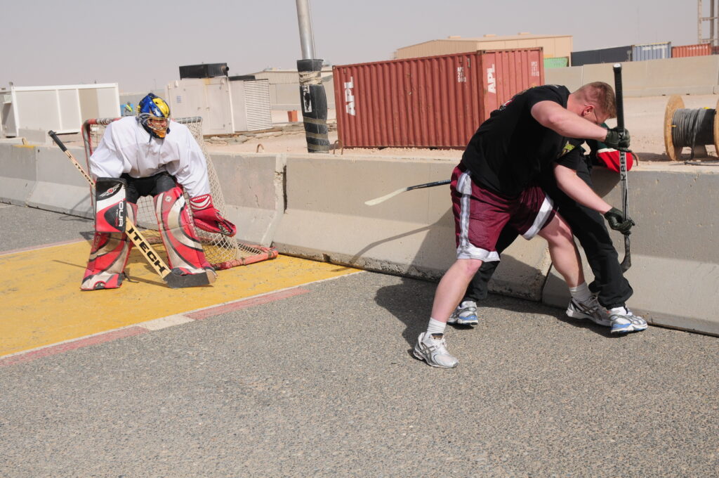 Soldiers play a hockey tournament in honor of Hockey Day. Camp Buehring, Kuwait.