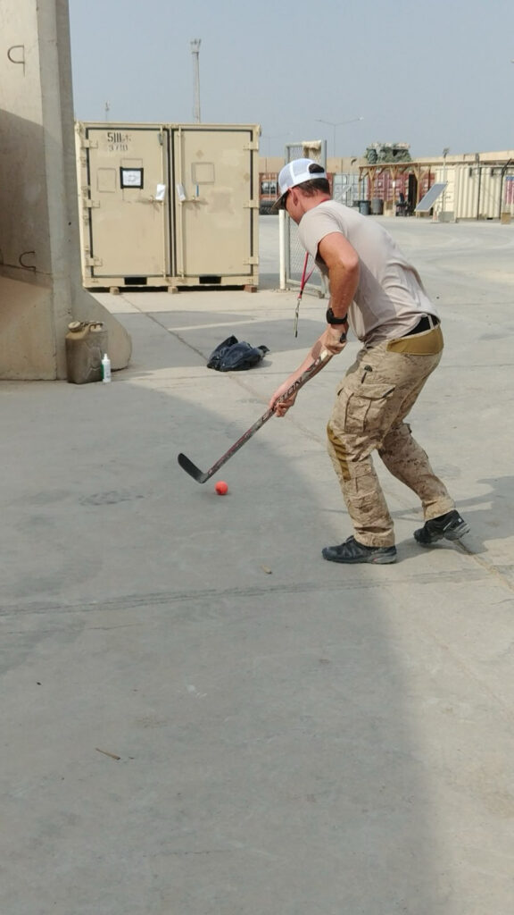 With scavenged sticks and an open patch of land, service members find a way to play no matter the terrain. 